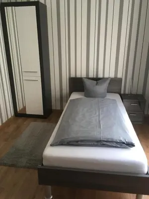 Ein Bett oder Betten in einem Zimmer der Unterkunft Pension Sonntag