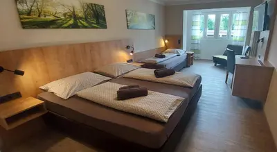 Ein Bett oder Betten in einem Zimmer der Unterkunft Pension DELAGERA