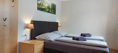 Ein Bett oder Betten in einem Zimmer der Unterkunft Pension DELAGERA