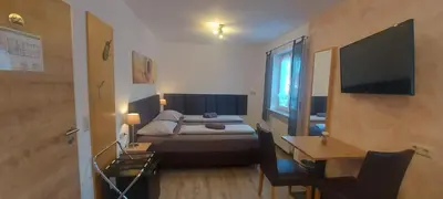 Ein Bett oder Betten in einem Zimmer der Unterkunft Pension DELAGERA