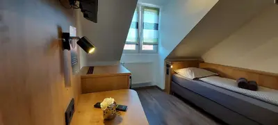 Ein Bett oder Betten in einem Zimmer der Unterkunft Pension DELAGERA