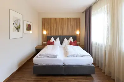 Ein Bett oder Betten in einem Zimmer der Unterkunft Hotel Staffler