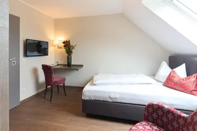 Ein Bett oder Betten in einem Zimmer der Unterkunft Hotel Staffler