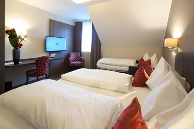 Ein Bett oder Betten in einem Zimmer der Unterkunft Hotel Staffler