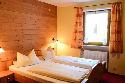 Ein Bett oder Betten in einem Zimmer der Unterkunft Gästehaus Sonnenbichl