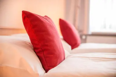 Ein Bett oder Betten in einem Zimmer der Unterkunft Landhotel zum Metzgerwirt