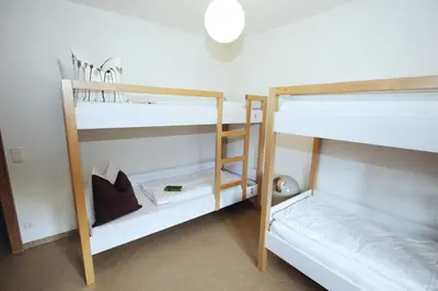 Ein Bett oder Betten in einem Zimmer der Unterkunft Berg Blick Jugendherberge mit Privatzimmer