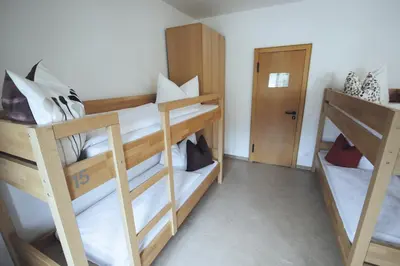 Ein Bett oder Betten in einem Zimmer der Unterkunft Berg Blick Jugendherberge mit Privatzimmer