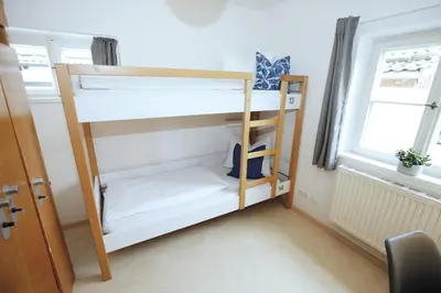 Ein Bett oder Betten in einem Zimmer der Unterkunft Berg Blick Jugendherberge mit Privatzimmer