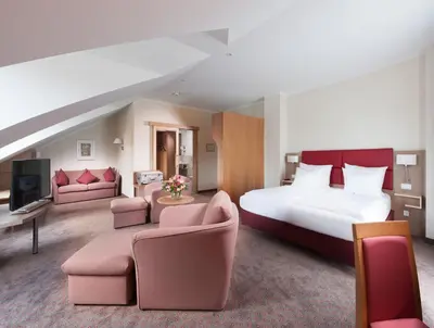Ein Bett oder Betten in einem Zimmer der Unterkunft Hotel Hachinger Hof