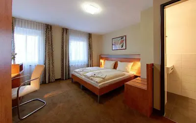 Ein Bett oder Betten in einem Zimmer der Unterkunft Hotel Gasthof Groß