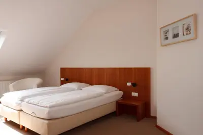 Ein Bett oder Betten in einem Zimmer der Unterkunft Altstadthotel Wetzel