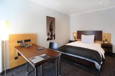 Ein Bett oder Betten in einem Zimmer der Unterkunft Schiller 5 Hotel