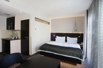 Ein Bett oder Betten in einem Zimmer der Unterkunft Schiller 5 Hotel