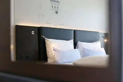 Ein Bett oder Betten in einem Zimmer der Unterkunft Schiller 5 Hotel