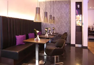 Ein Sitzbereich in der Unterkunft Schiller 5 Hotel