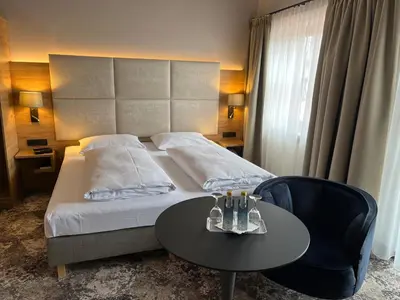 Ein Bett oder Betten in einem Zimmer der Unterkunft Appartment-Hotel-Hölzl
