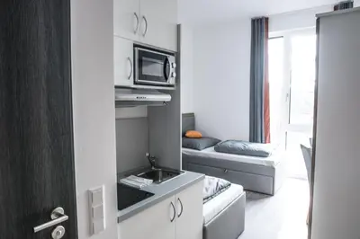 Ein Bett oder Betten in einem Zimmer der Unterkunft FirstSleep Boardinghouse Griesfeldstrasse München
