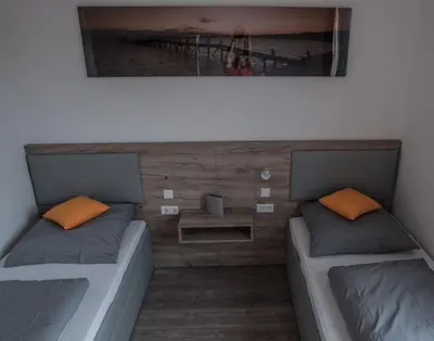 Ein Bett oder Betten in einem Zimmer der Unterkunft FirstSleep Boardinghouse Griesfeldstrasse München
