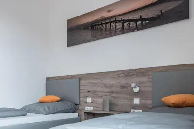 Ein Bett oder Betten in einem Zimmer der Unterkunft FirstSleep Boardinghouse Griesfeldstrasse München