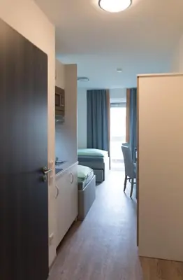 Ein Bett oder Betten in einem Zimmer der Unterkunft FirstSleep Boardinghouse Griesfeldstrasse München