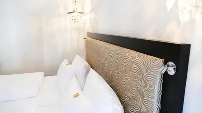 Ein Bett oder Betten in einem Zimmer der Unterkunft Hotel an der Oper