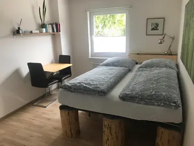 Ein Bett oder Betten in einem Zimmer der Unterkunft Gästehaus Grabbe