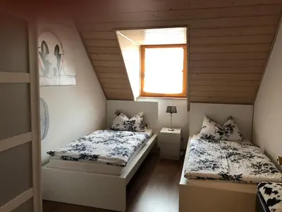 Ein Bett oder Betten in einem Zimmer der Unterkunft Ferienwohnung Held