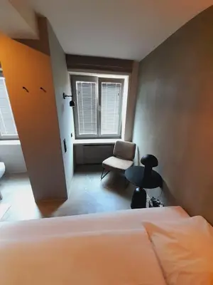 Ein Bett oder Betten in einem Zimmer der Unterkunft Hotel Mons am Goetheplatz