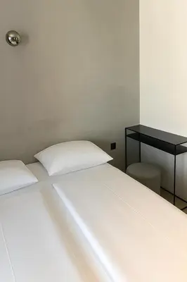 Ein Bett oder Betten in einem Zimmer der Unterkunft Hotel Mons am Goetheplatz