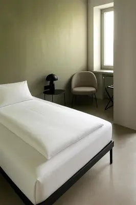 Ein Bett oder Betten in einem Zimmer der Unterkunft Hotel Mons am Goetheplatz