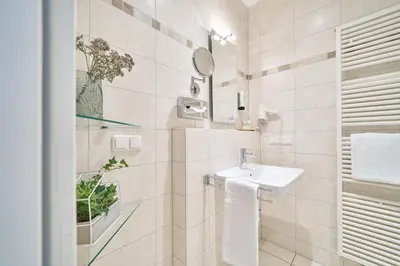 Ein Badezimmer in der Unterkunft Hotel am Hof