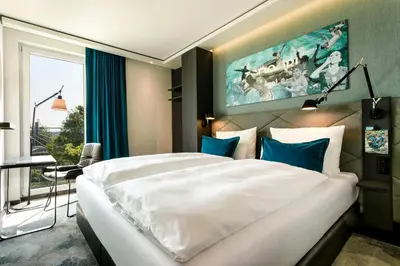 Ein Bett oder Betten in einem Zimmer der Unterkunft Motel One München-Garching