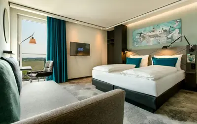Ein Bett oder Betten in einem Zimmer der Unterkunft Motel One München-Garching
