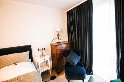 Ein Bett oder Betten in einem Zimmer der Unterkunft das kleine Hotel in München