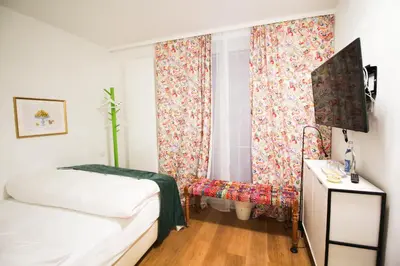 Ein Bett oder Betten in einem Zimmer der Unterkunft das kleine Hotel in München
