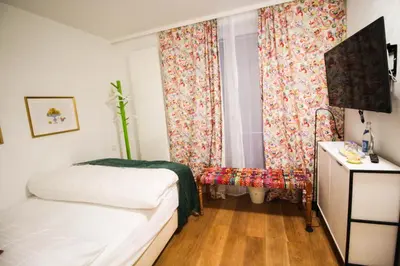 Ein Bett oder Betten in einem Zimmer der Unterkunft das kleine Hotel in München