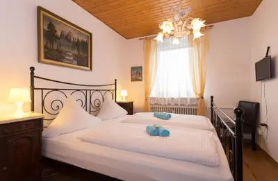 Ein Bett oder Betten in einem Zimmer der Unterkunft Hotel Moosbichl