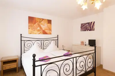 Ein Bett oder Betten in einem Zimmer der Unterkunft Hotel Moosbichl