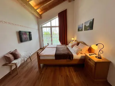 Ein Bett oder Betten in einem Zimmer der Unterkunft Ferienwohnung Enzian im Haus Schmid