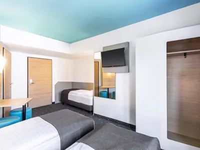 Ein Bett oder Betten in einem Zimmer der Unterkunft B&B Hotel München City-Ost
