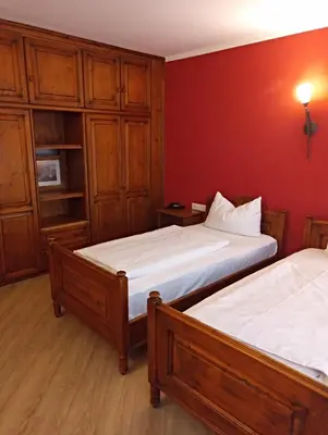 Ein Bett oder Betten in einem Zimmer der Unterkunft Hotel Atlas Sport