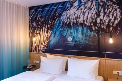 Ein Bett oder Betten in einem Zimmer der Unterkunft Arthotel ANA Aura