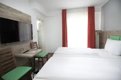 Ein Bett oder Betten in einem Zimmer der Unterkunft Hotel Pension Köberl
