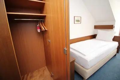 Ein Bett oder Betten in einem Zimmer der Unterkunft Hotel Pension Köberl