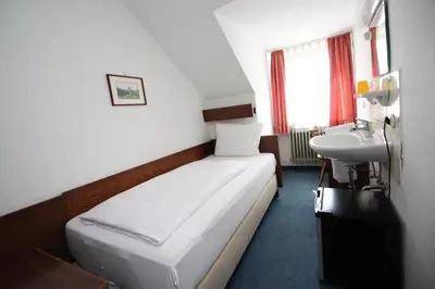Ein Bett oder Betten in einem Zimmer der Unterkunft Hotel Pension Köberl