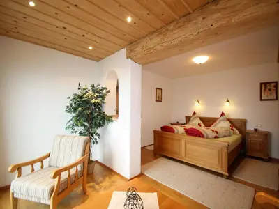 Ein Bett oder Betten in einem Zimmer der Unterkunft Hacher Josef - Bergpanorama Ferienwohnungen | Chiemgau Karte