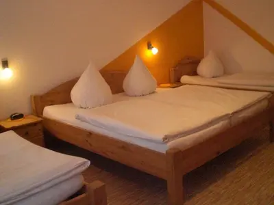 Ein Bett oder Betten in einem Zimmer der Unterkunft Gasthof Fröhlich