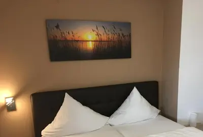 Ein Bett oder Betten in einem Zimmer der Unterkunft Gasthof Fröhlich
