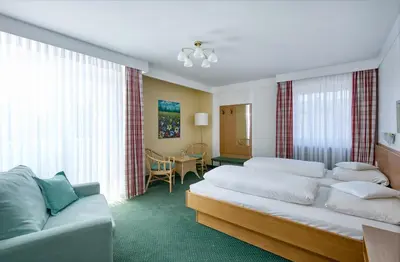 Ein Bett oder Betten in einem Zimmer der Unterkunft Hotel Mayer